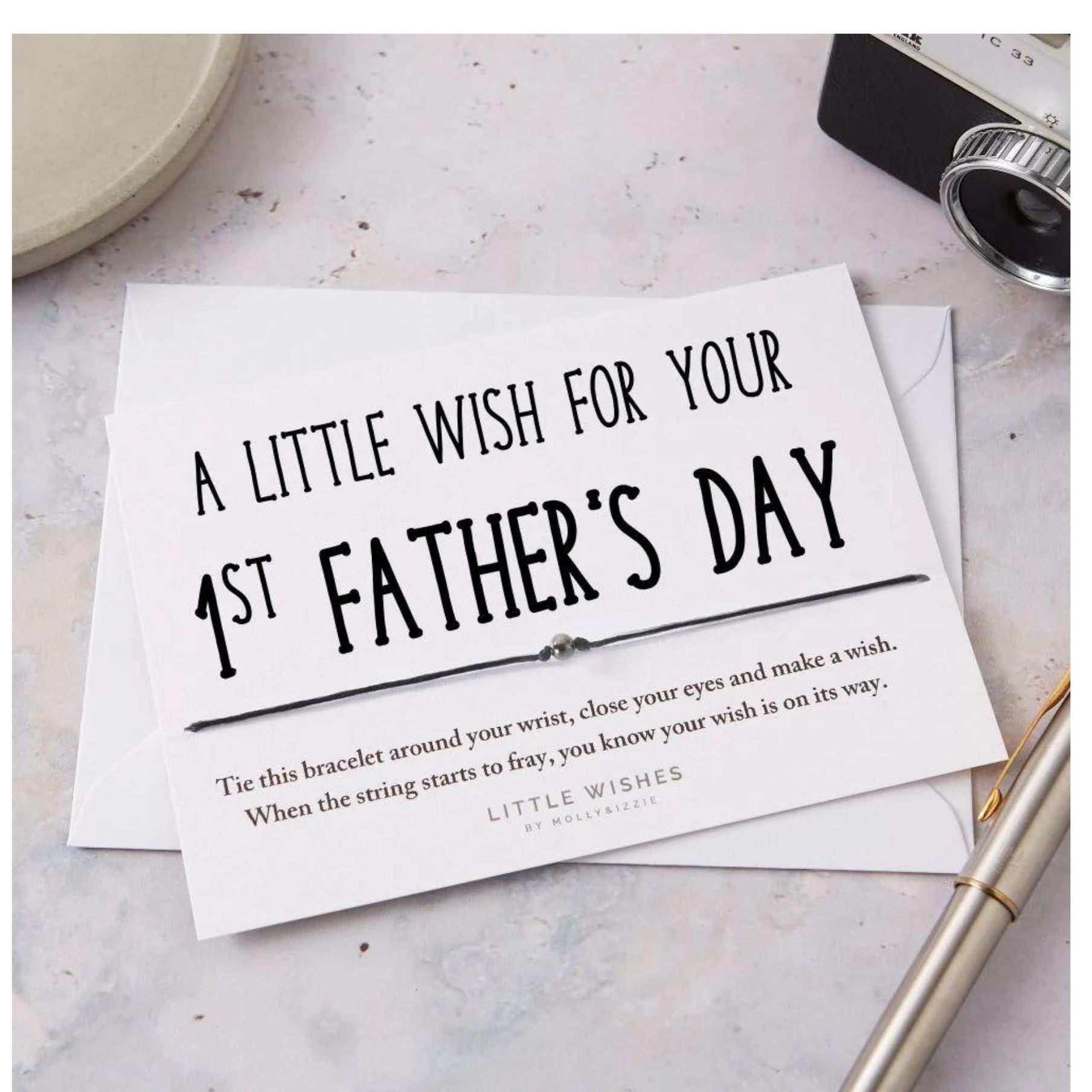 A cord bracelet on a white card with the sentiment &#39;A Little Wish For Your 1st Father&#39;s Day&#39;