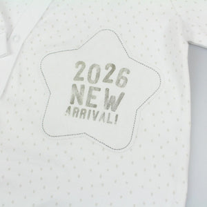 White cotton baby sleepsuit with 2026 New Arrival text