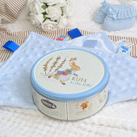 A biscuit tim featuring Peter Rabbit and the words Run Along Home on the lid.  Fileld with delicous biscuits.