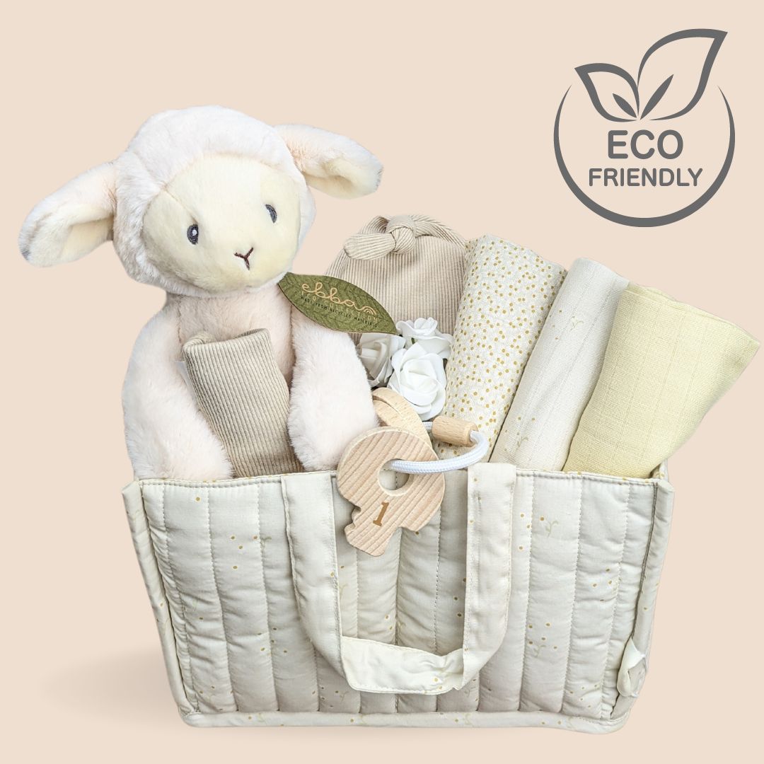 Baby shower gift basket. Eco friendly cream lamb and gifts which are sustainable packed in a soft basket.