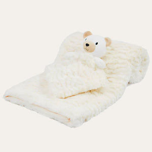 Cream baby blanket and comforter set.