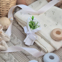 White 100% cotton baby anti-scratch mittens displayed as a mini flower bouquet. 