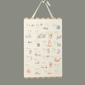 Children's alphabet nursery wall plaque with illustrations of Disney Winnie the Pooh animals and letters.