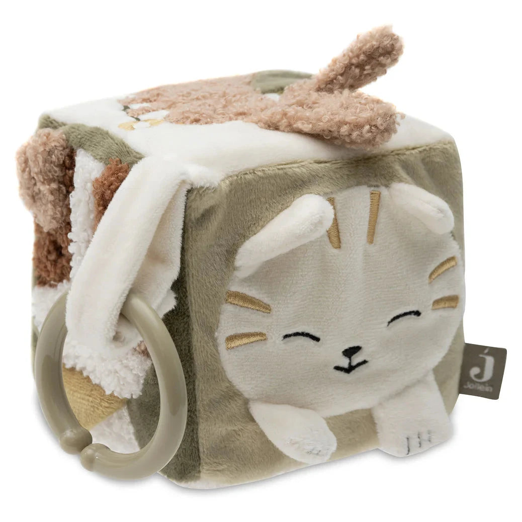Plush toy cube with cat design and textured surface on a white background