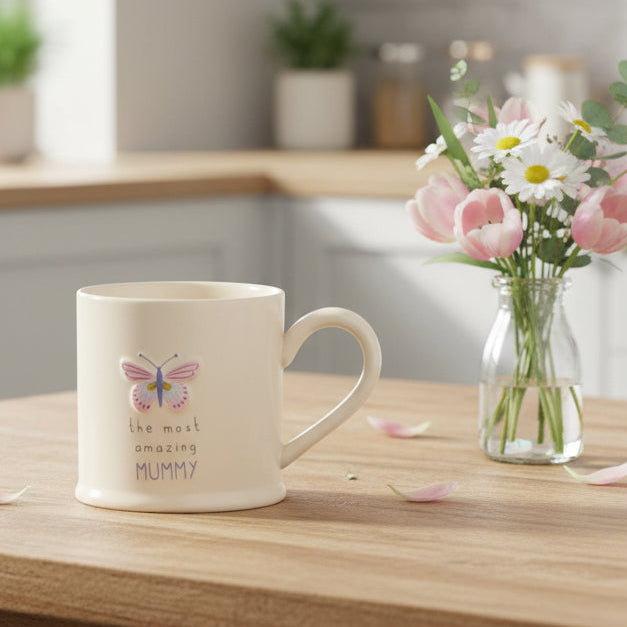 Amazing mummy mug with embossed pink butterfly design and the most amazing mummy wording on a cream white stoneware mug 