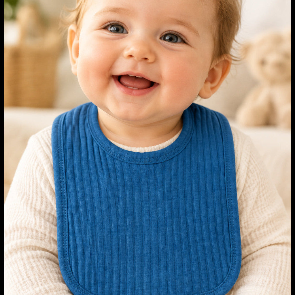 Azure blue cotton baby bib with Velcro fastening