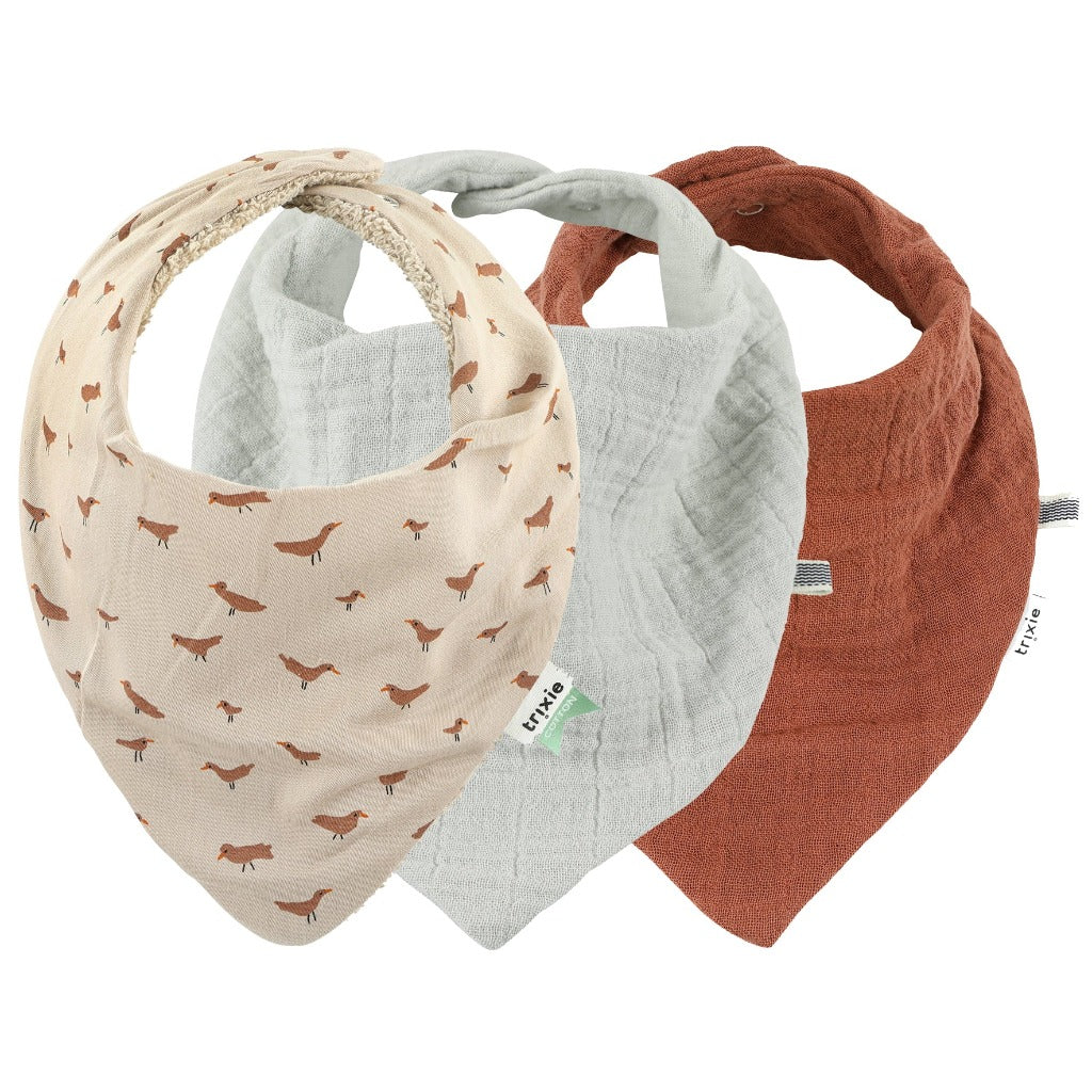 Set of 3 organic muslin bandana bibs.  One is pale green, one is deep rust and the other has prints of birds