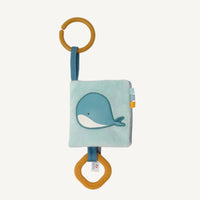 Soft ocean themed baby activity book with sensory pages and link to attach to pram or cot