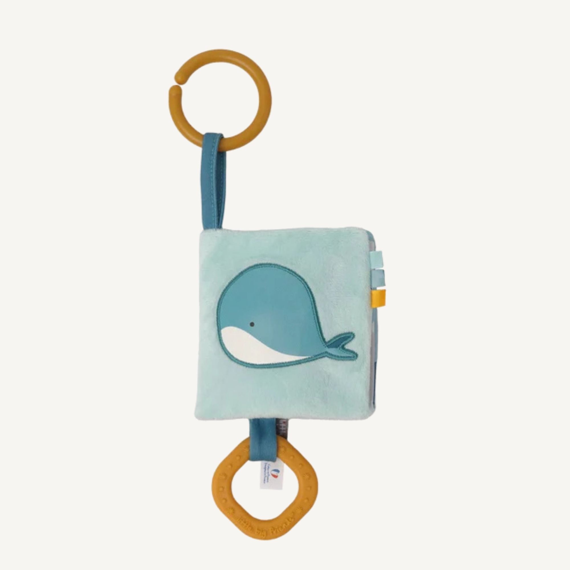Soft ocean themed baby activity book with sensory pages and link to attach to pram or cot
