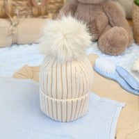 Soft neutral baby hat with sparkly pom pom