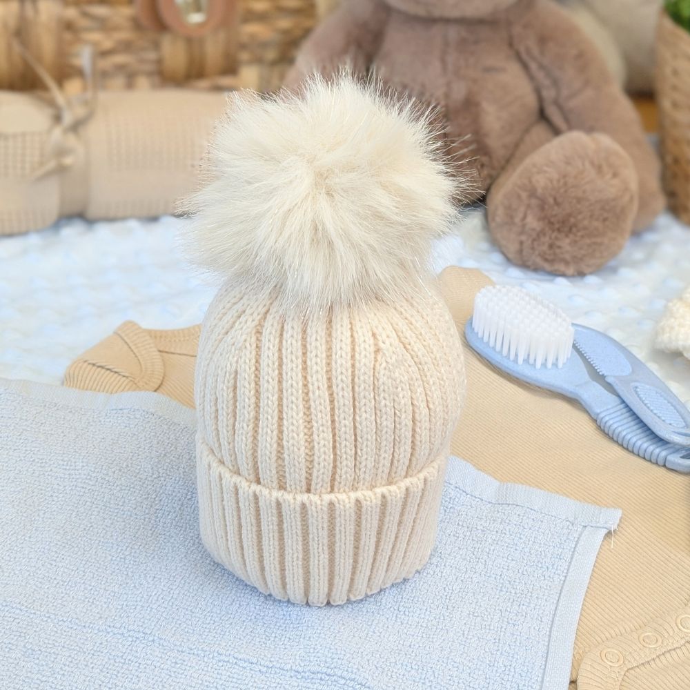 Soft neutral baby hat with sparkly pom pom