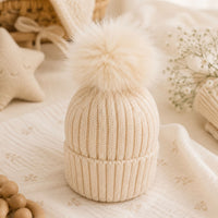 Soft neutral baby hat with sparkly pom pom