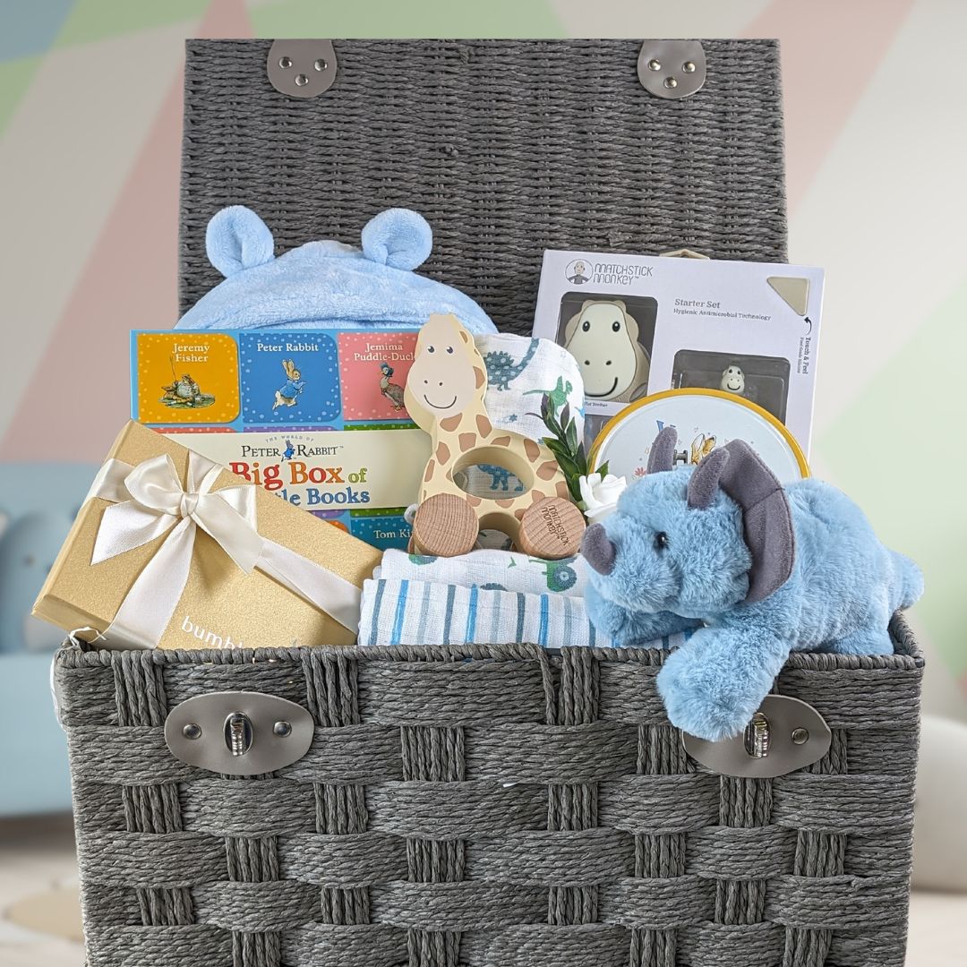 Large baby boy hamper with gifts for the baby along with chocolates and biscuits for the new parents.