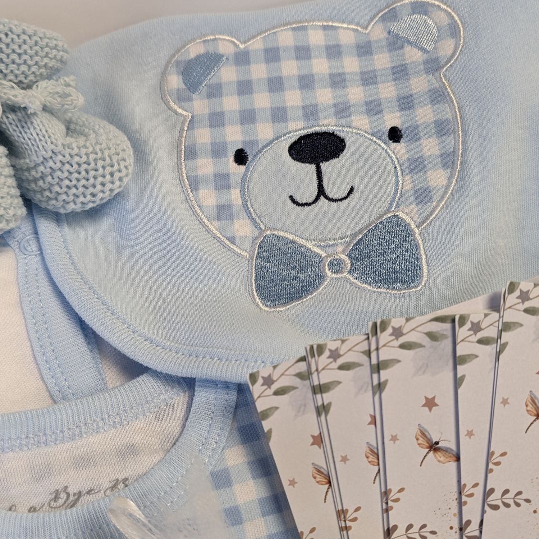 baby shower gifts hamper with blue teddy outfit and gifts for mum