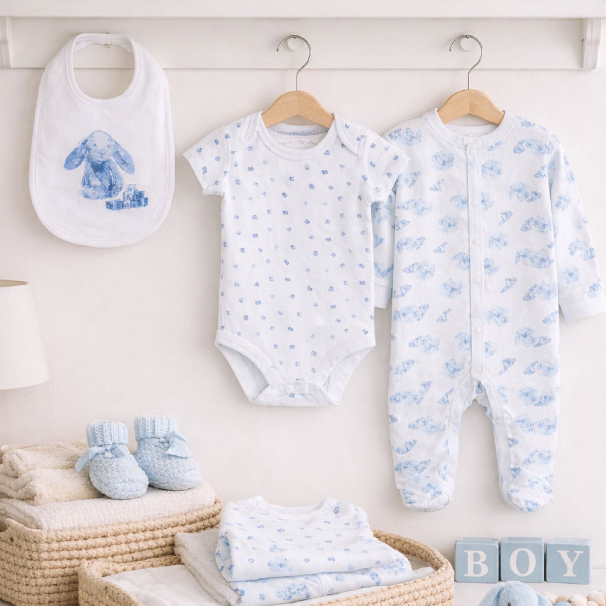 A blue and white baby clothing set with a bunny theme in soft cotton
