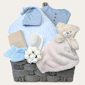 Newborn Baby boy gifts basket with blanket and blue clothes. Hamper by Bumbles and Boo.