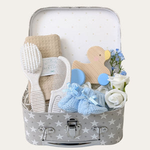Newborn baby boy gifts in a hamper. Presents include eco friendly baby accessories. Bumbles and Boo.