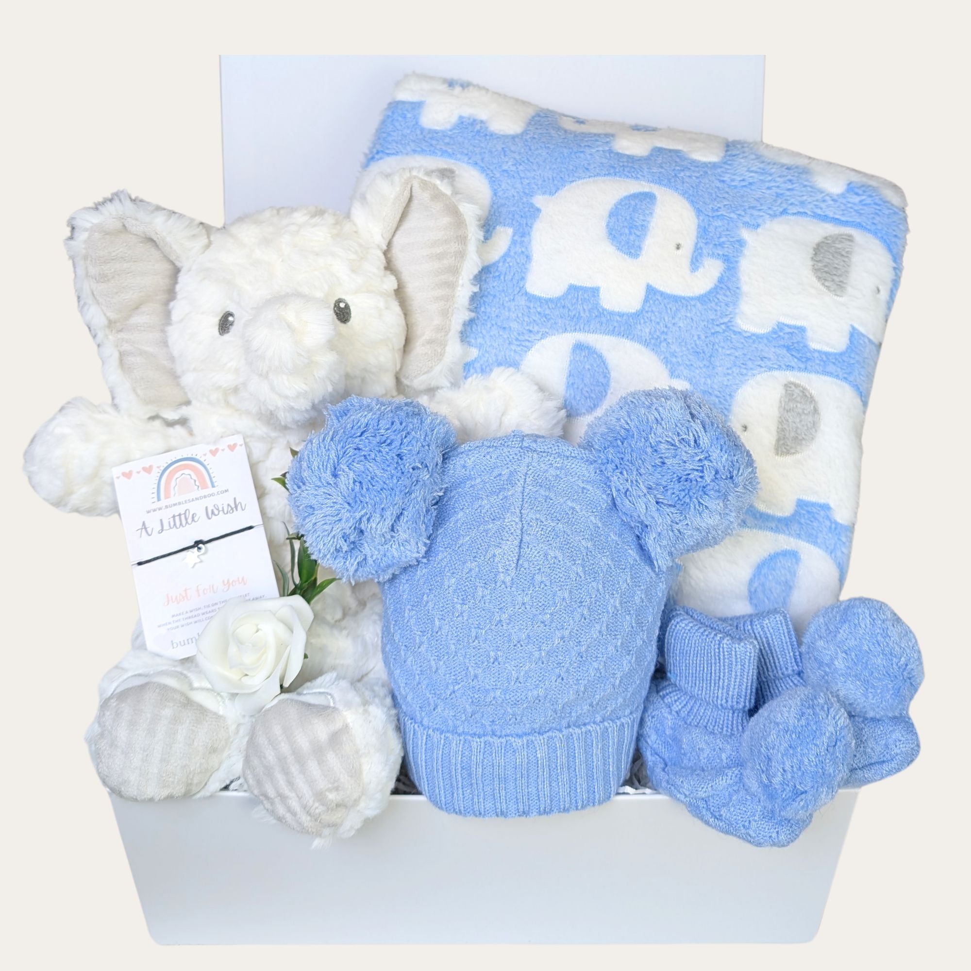 Baby boy gifts box hamper with elephant soft toy, blue elephant blanket and newborn presents by Bumbles and Boo.