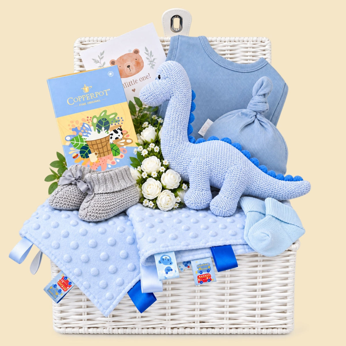 Baby boy gifts hamper with blue organic dinosaur and gifts for parents. Bumbles and Boo.