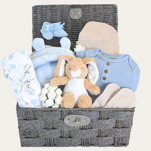 New baby boy gifts hamper basket with blue dressing gown and clothes set by Bumbles and Boo.