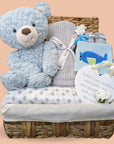 Baby boy hamper basket with blue teddy.