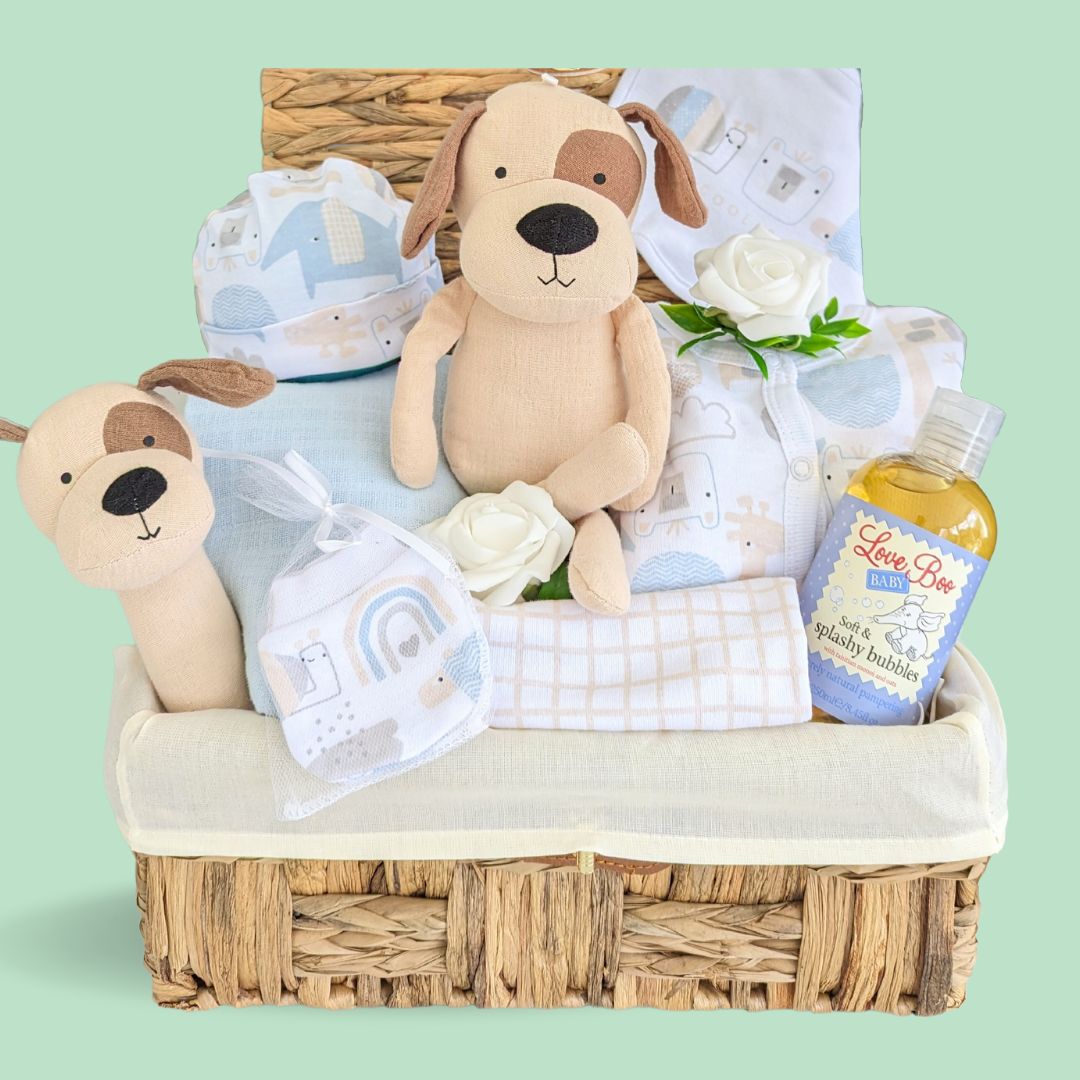 Baby boy hamper with gifts including  baby clothing set, muslin,  puppy dog soft toy and baby wash. in an eco keepsake basket. 