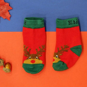 Festive baby socks with red and green design