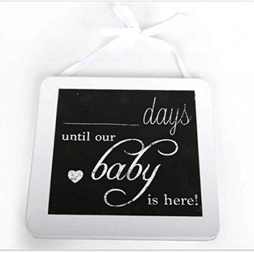 Hanging baby countdown plaque with a black panel, white ribbon and space to write the days.