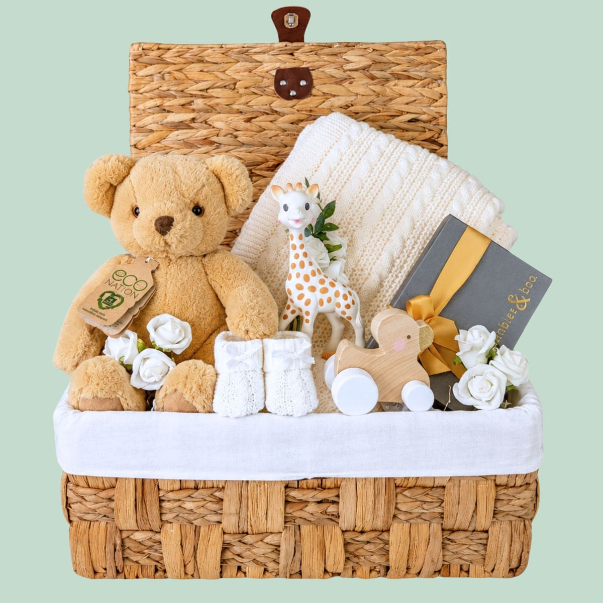 New baby hamper basket by Bumbles and Boo. Presents  include teddy bear, baby blanket, wooden toy and gift for mum.