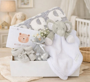 Baby gifts box with a grey elephant blanket and white elephant comforter with a gift for mum.