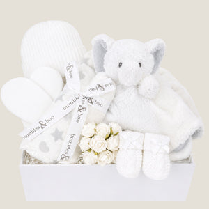Baby gifts box with white and grey presents to welcome a new baby.