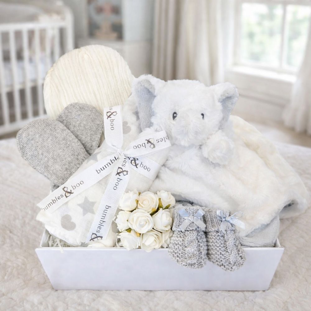 Baby gifts box with white and grey presents to welcome a new baby.
