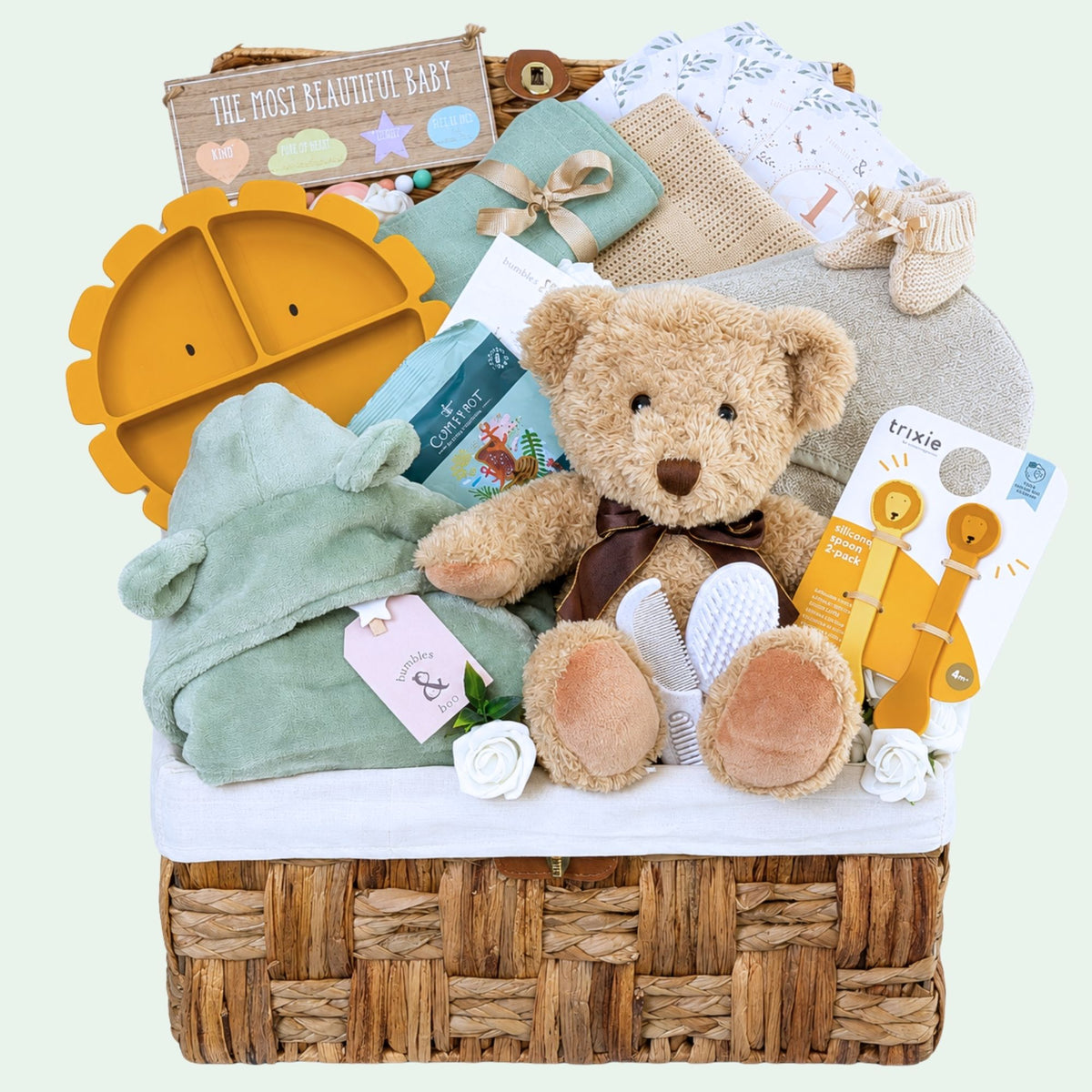 Luxury baby gift hamper with sage and mustard tones, featuring practical baby gifts and soft toys – perfect for a newborn present.