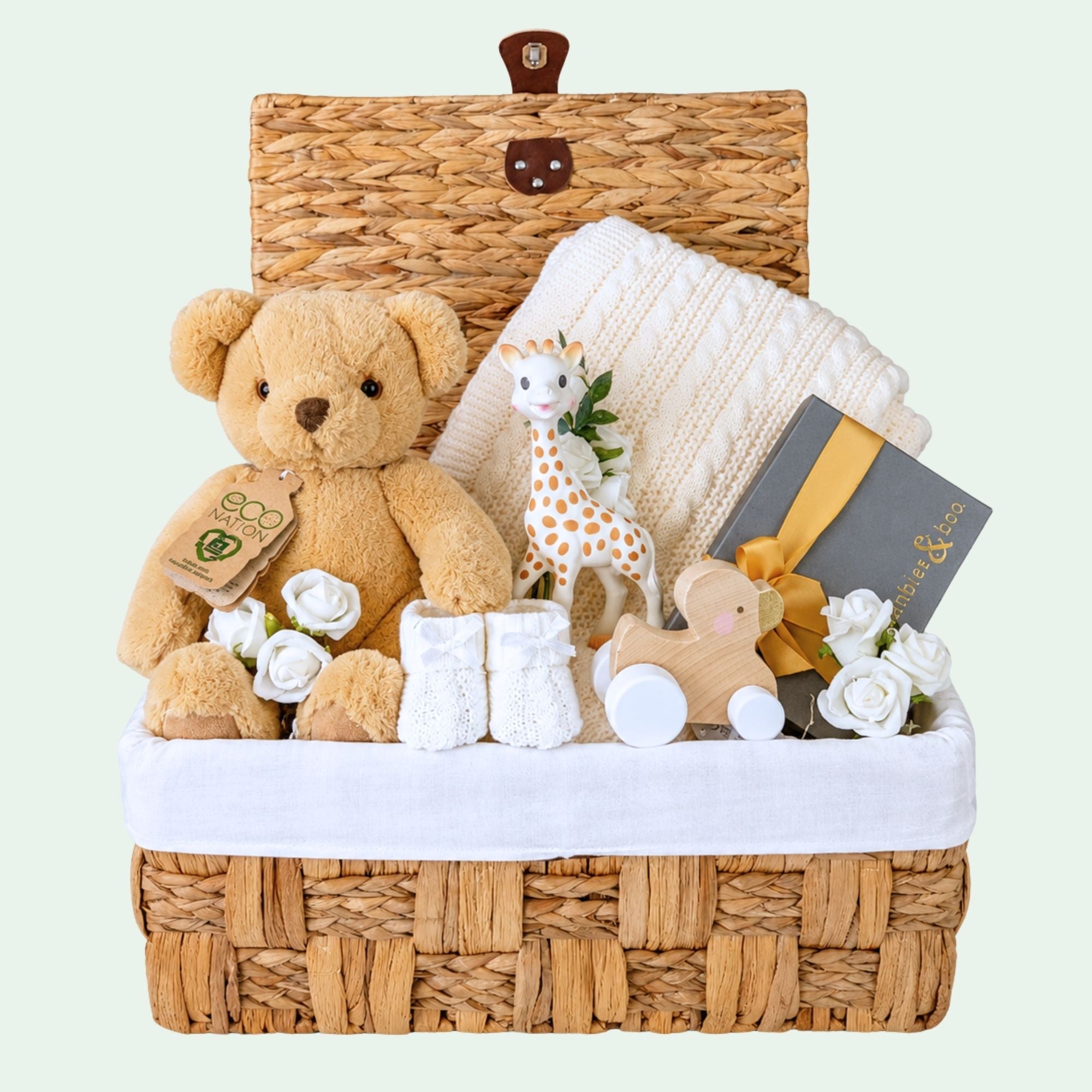 New baby hamper basket by Bumbles and Boo. Presents  include teddy bear, baby blanket, wooden toy and gift for mum.