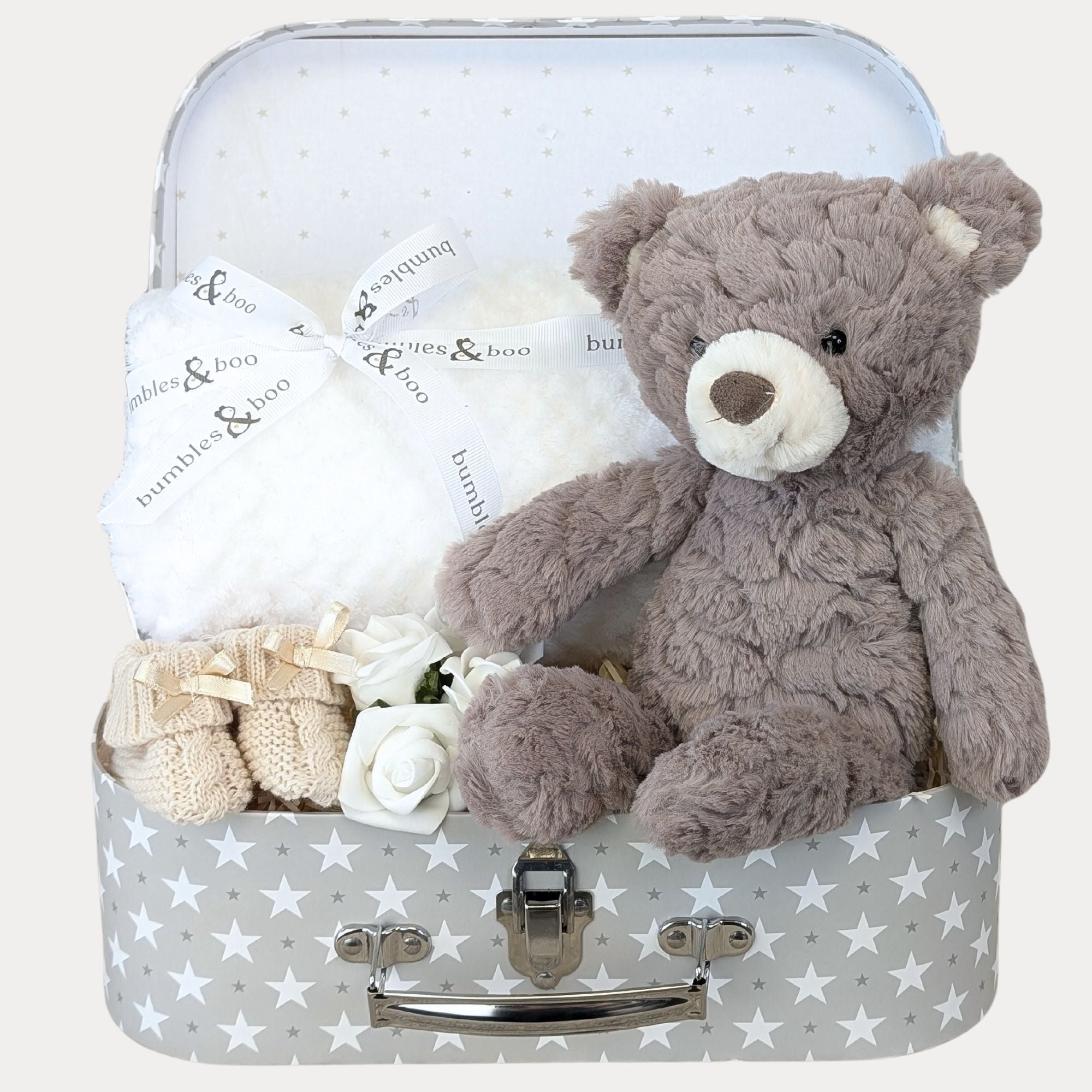 Baby gifts hamper with presents including bear and white blanket in a grey stars luggage case by Bumbles and Boo.