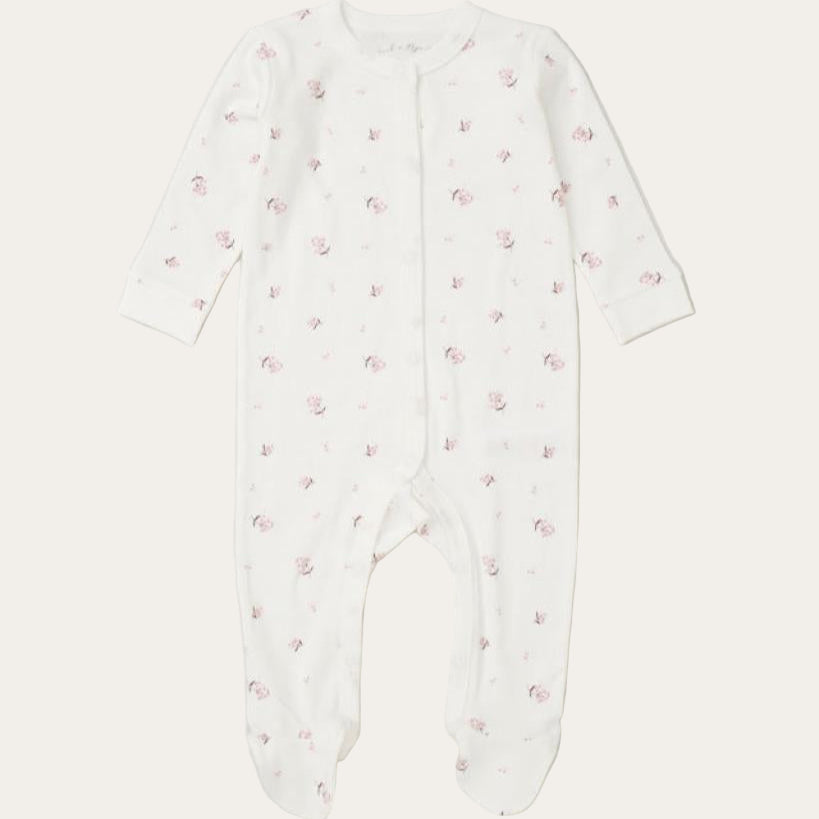 White baby onesie with pink floral pattern 