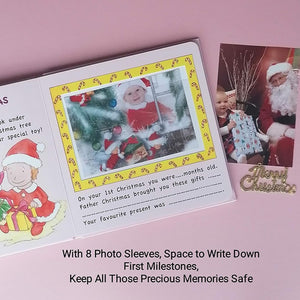 Baby girl’s first Christmas memory book page with Santa photo