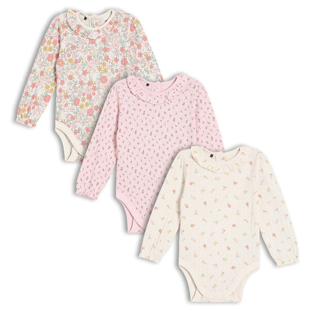 Three long sleeve baby bodysuits in colourful floral, pink sprig and cream prints.