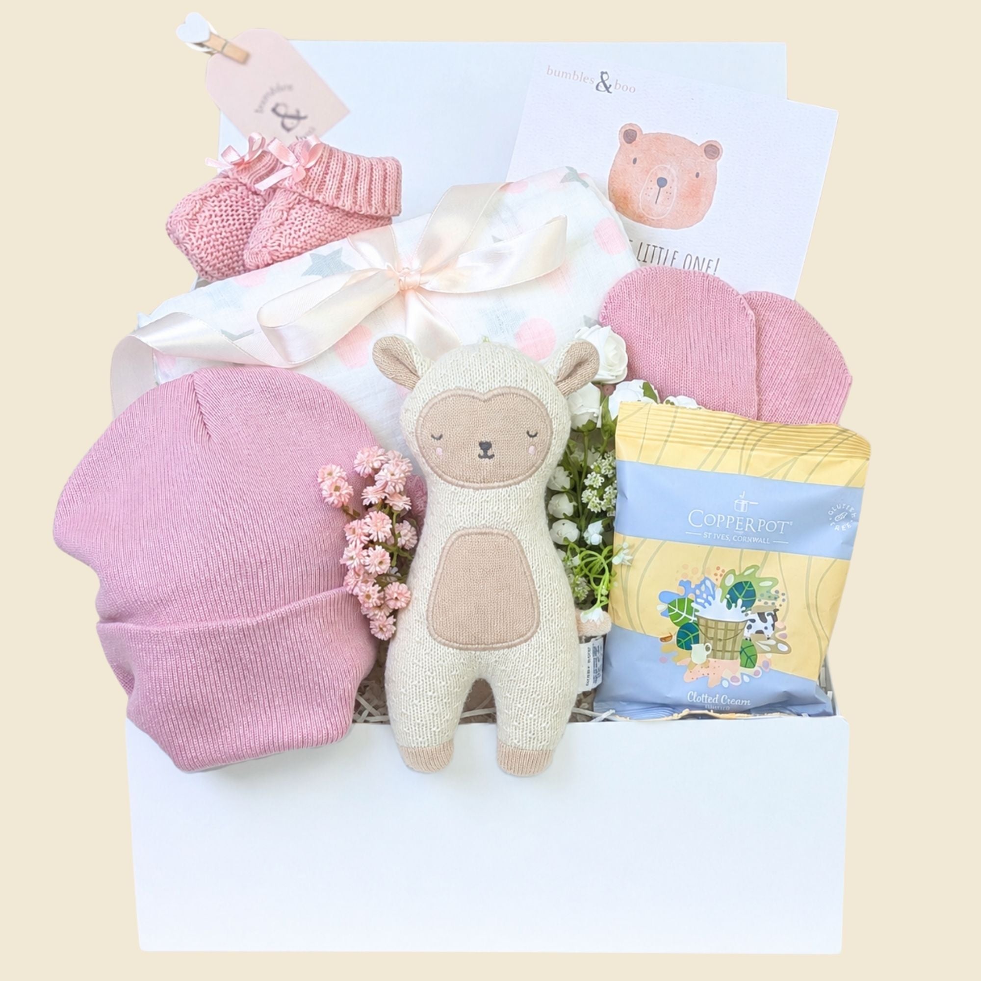 Newborn baby girl gifts box with pink and white presents including lamb soft toy. Hamper by Bumbles and Boo.