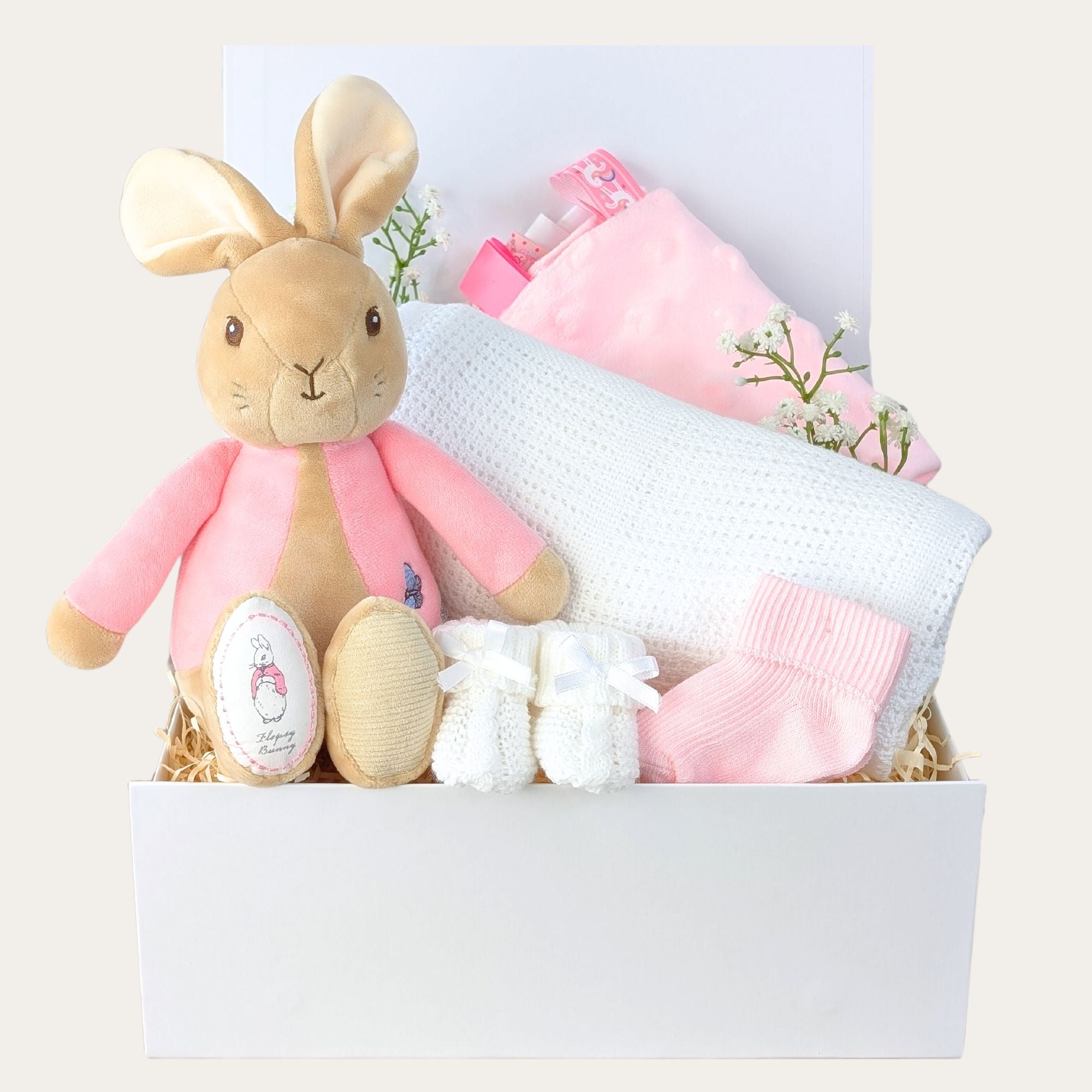 Baby girl gifts box with a pink flopsy bunny soft toy and baby blanket in white gift box. Bumbles and Boo.