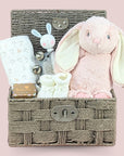 Baby girl gifts hamper with bunny theme and chocolates for the new parents.