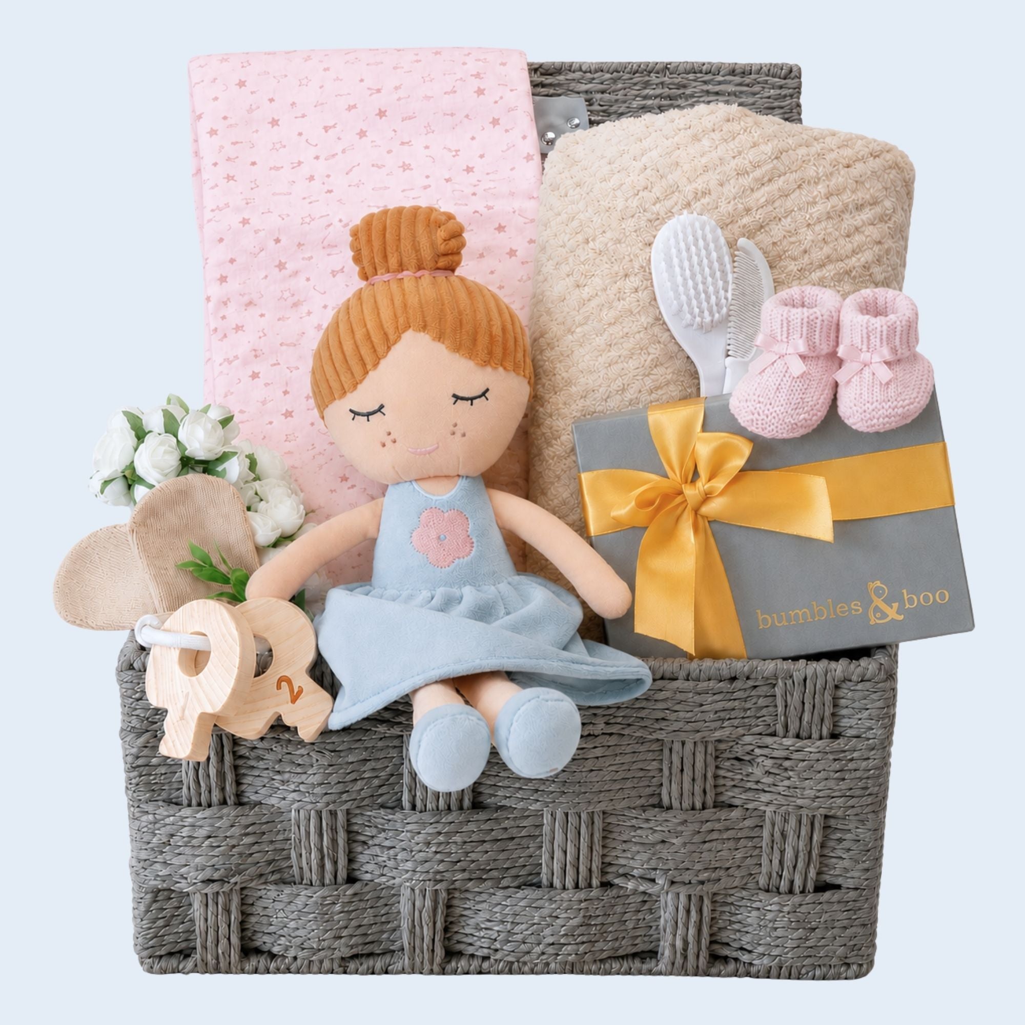 Baby girl gifts hamper with rag dolly soft toy, blanket and chocolates for the new parents