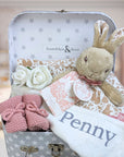 baby girl gifts keepsake trunk with flopsy bunny and knit baby girl booties.