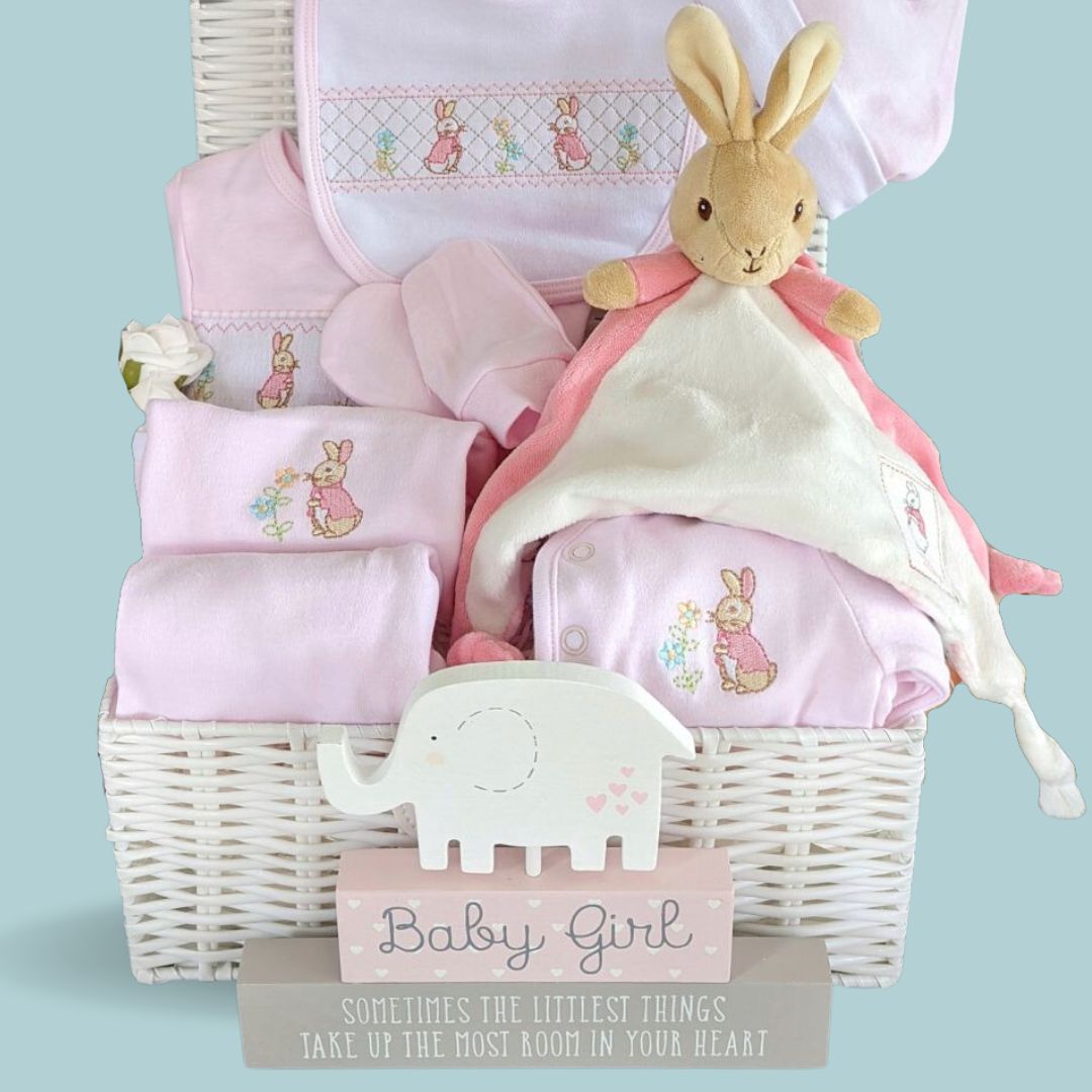 Baby girl gift hamper with pink flopsy bunny.