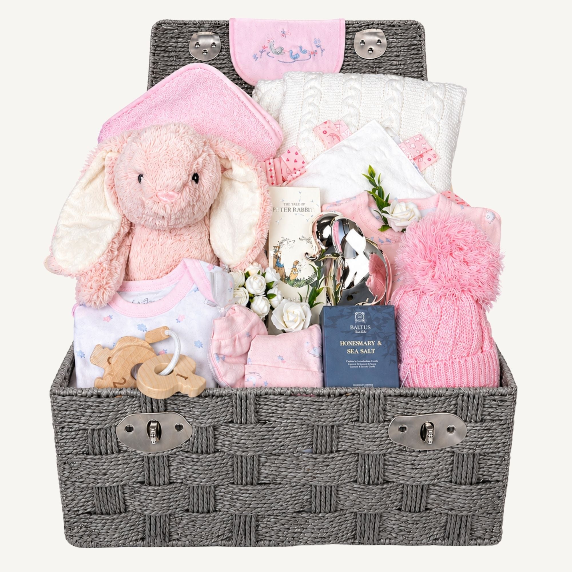New baby girl hamper basket with pink gifts include bunny and blanket and silver money box.