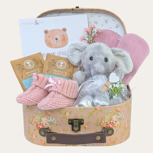 A baby girl gifts hamper with presents including elephant soft toy and chocolates for mum. Bumbles and Boo.