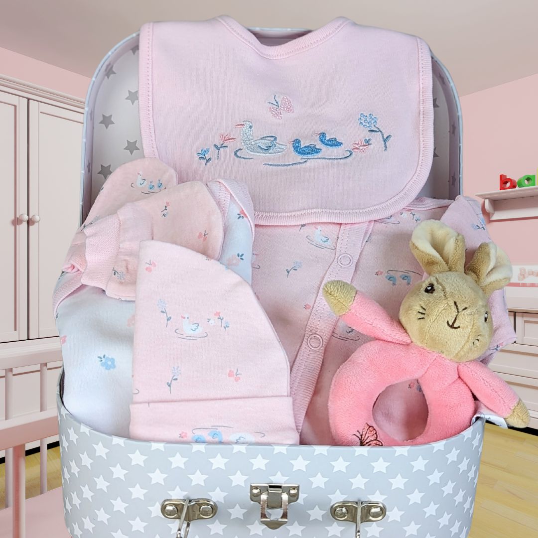Beautiful keepsake hamper gift for a precious baby girl. Includes delicate clothing set and little flopsy bunny hand rattle. Beautiful presentation.