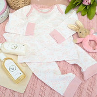 Baby girl pyjamas in pink with an elephant design. Comes as a top and trousers.