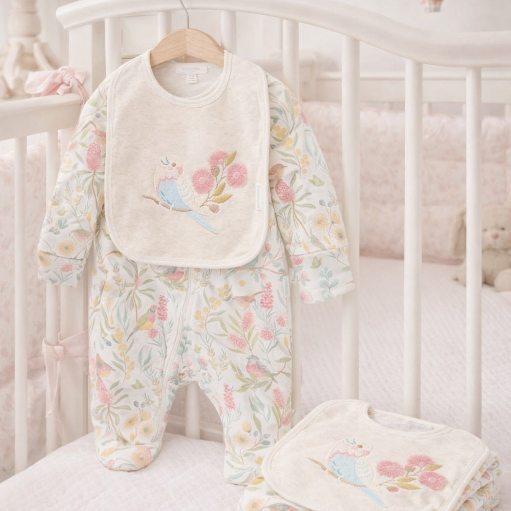 Baby outfit with floral design in pink and blue with wild bird theme