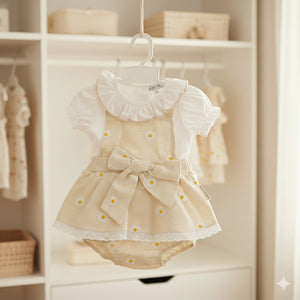 Baby girl taupe gingham floral dress set with lace trim, bow detail and white short sleeve top with matching bloomers.